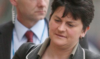 Arlene Foster, Acting Northern Ireland First Minster, arrives for her first day in office at Parliament Buildings, Stormont, Belfast, Northern Ireland, Tuesday, Jan. 12, 2010. In an emotional statement Monday, First Minister Peter Robinson said he would step aside for a few weeks to answer questions about his wife's romantic and financial dealings with the 19-year-old for whom she helped raised tens of thousands of pounds (dollars) when she was 58. (AP Photo/Peter Morrison)